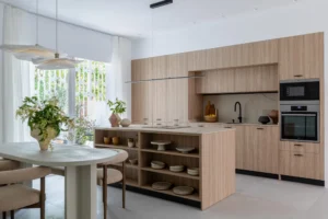 INKO Kitchens premium design kitchen in light wood, island with open shelves and built-in appliances, Malaga