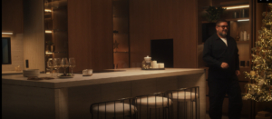 Cocina moderna minimalista con isla de piedra, frentes en madera cálida y iluminación LED integrada; líneas rectas – INKO Cocinas